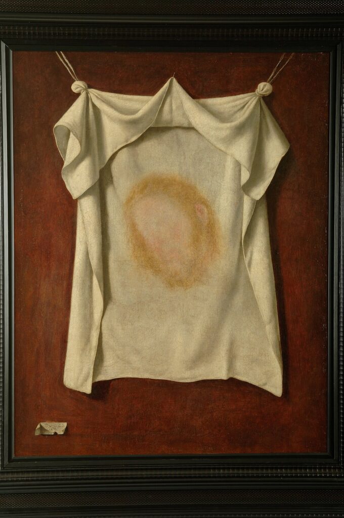 The face of Christ imprinted on Veronica's white veil against a dark background, by Zurbaran.