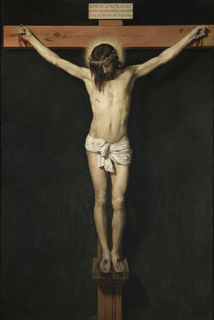 Velazquez painting of Jesus Christ crucified on the cross against a dark background, head bowed.