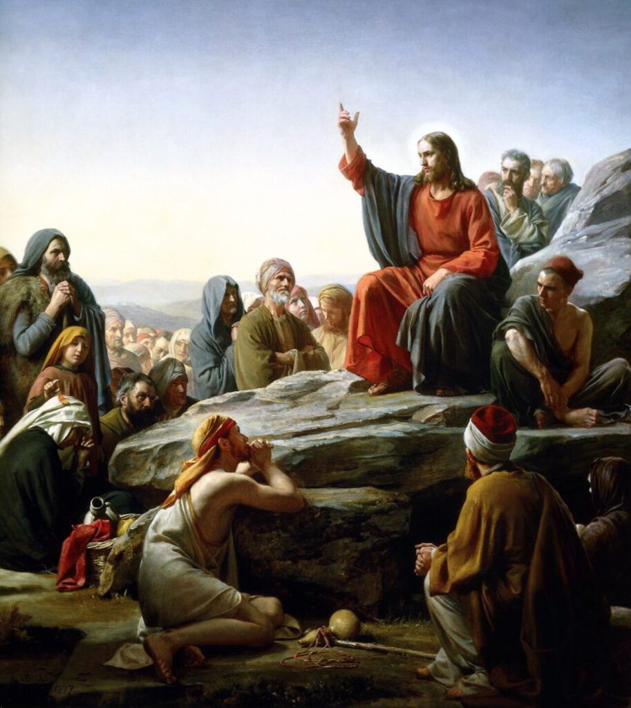 Carl Bloch painting of Christ seated on a hillside teaching a gathered crowd, the Sermon on the Mount.