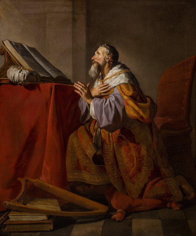A penitent King David in prayer with his harp.