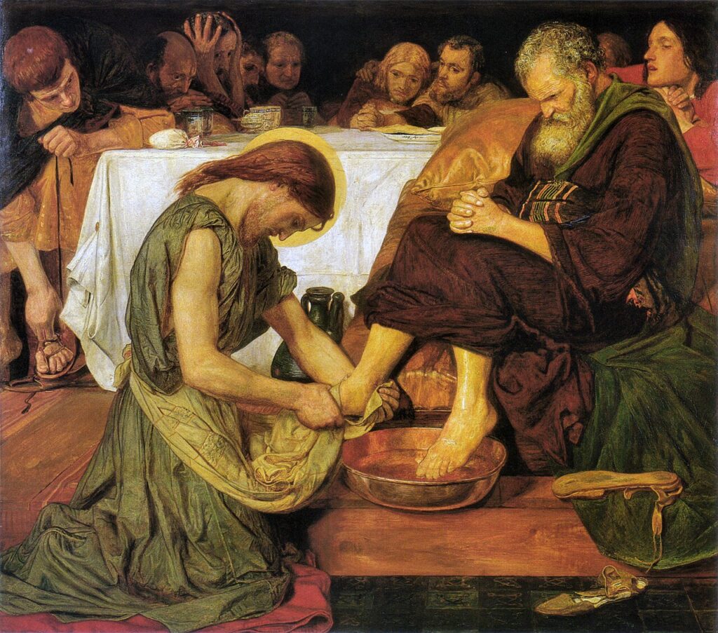 Jesus humbly washing Saint Peter feet.